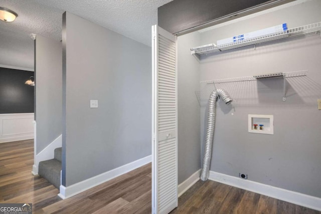 washroom featuring hookup for an electric dryer, dark hardwood / wood-style flooring, and washer hookup