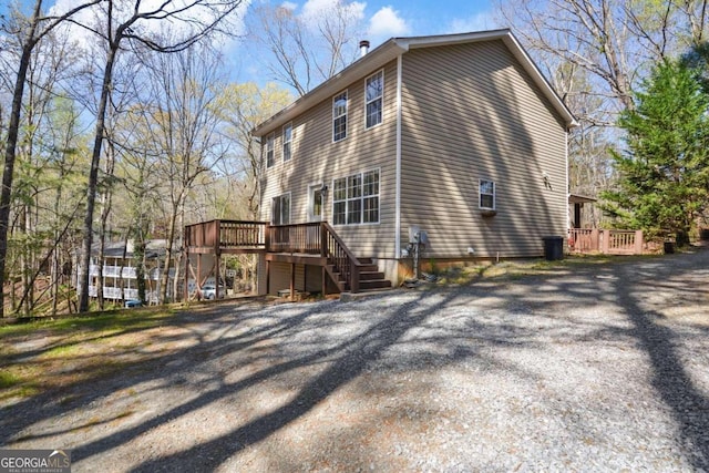 view of home's exterior with a wooden deck