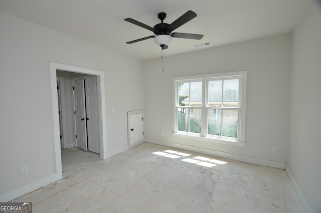 unfurnished room with ceiling fan