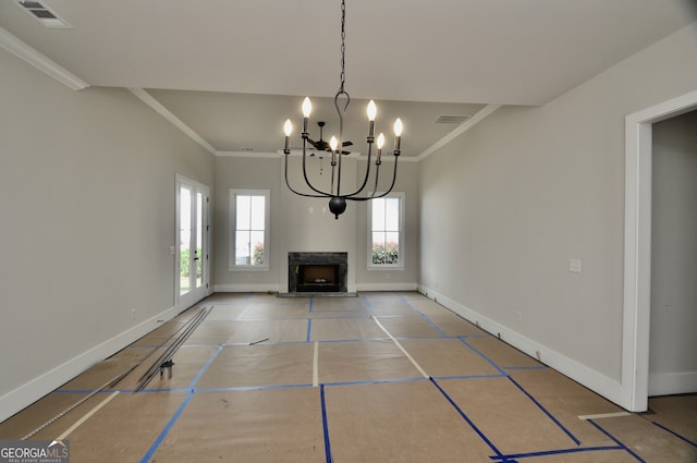 unfurnished living room featuring a notable chandelier and crown molding