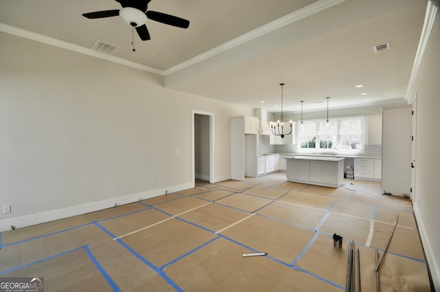 unfurnished living room with ceiling fan with notable chandelier and crown molding