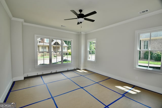 tiled empty room with ceiling fan, plenty of natural light, and crown molding