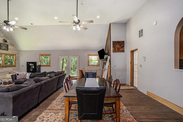 dining room with ceiling fan, high vaulted ceiling, and dark hardwood / wood-style floors