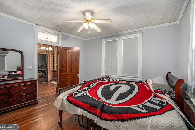 bedroom with a textured ceiling, ceiling fan with notable chandelier, ornamental molding, and dark wood-type flooring