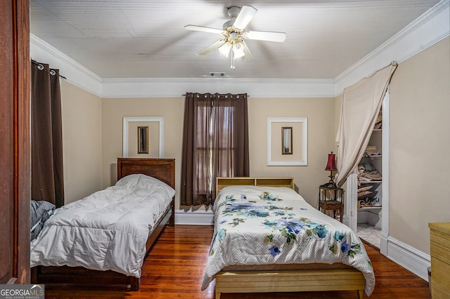 bedroom with dark hardwood / wood-style floors, ceiling fan, and crown molding