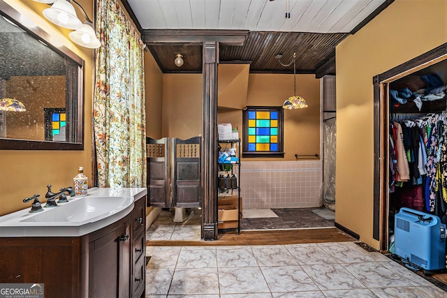 bathroom with vanity and wooden ceiling