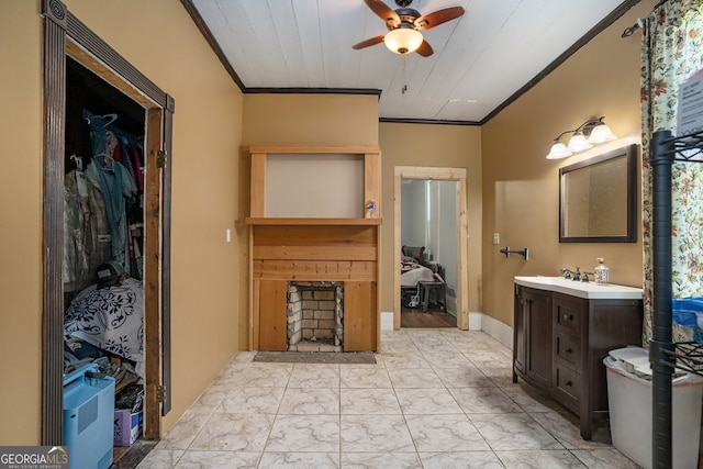 bathroom featuring wood ceiling, ceiling fan, ornamental molding, and vanity