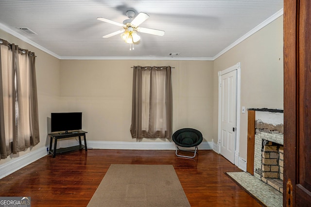 sitting room with dark hardwood / wood-style floors, ceiling fan, and ornamental molding