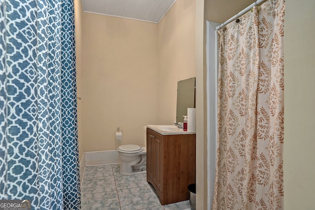 bathroom featuring tile patterned floors, vanity, and toilet