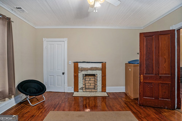 unfurnished living room with ceiling fan, dark hardwood / wood-style flooring, and crown molding