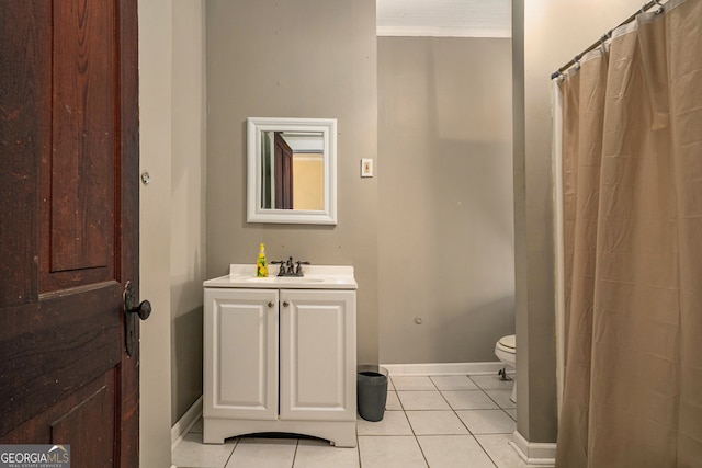 bathroom with tile patterned floors, vanity, and toilet