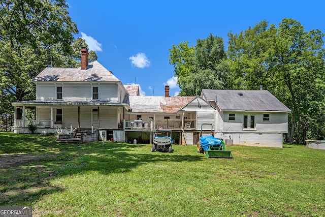 back of house with a yard