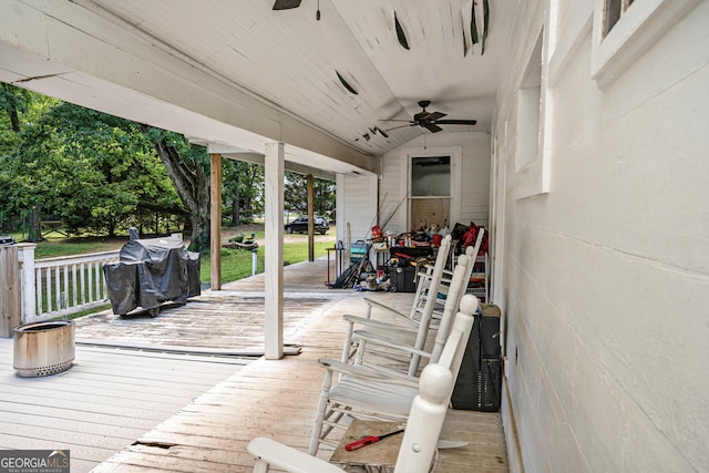 wooden deck featuring ceiling fan