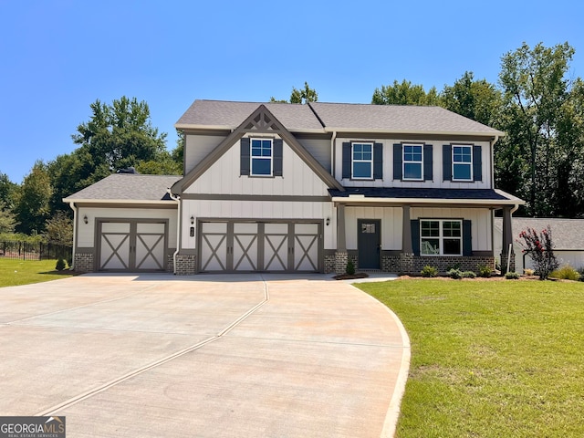 view of front of home featuring a garage and a front lawn