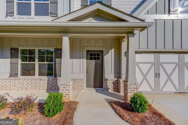 entrance to property with a porch and a garage