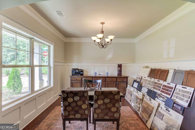 home office featuring dark hardwood / wood-style flooring, a notable chandelier, and ornamental molding