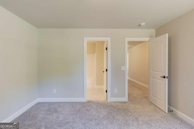 unfurnished bedroom with light carpet