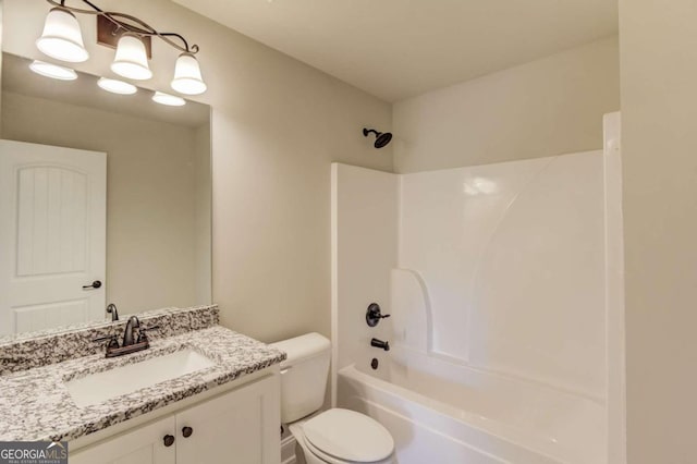 full bathroom featuring bathing tub / shower combination, toilet, and vanity