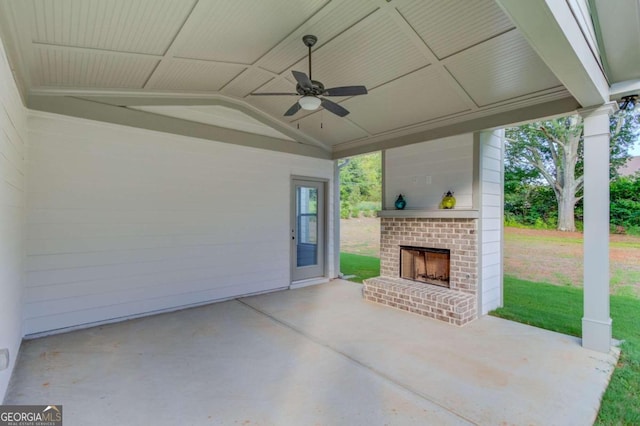 view of patio with ceiling fan and an outdoor brick fireplace