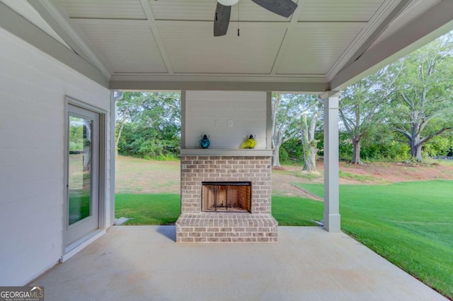 view of patio / terrace with ceiling fan and an outdoor brick fireplace