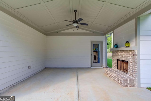 view of patio / terrace with ceiling fan and an outdoor brick fireplace