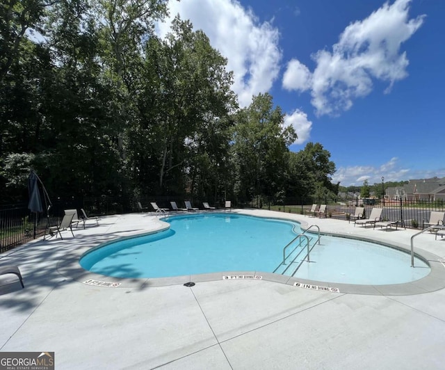 view of swimming pool featuring a patio