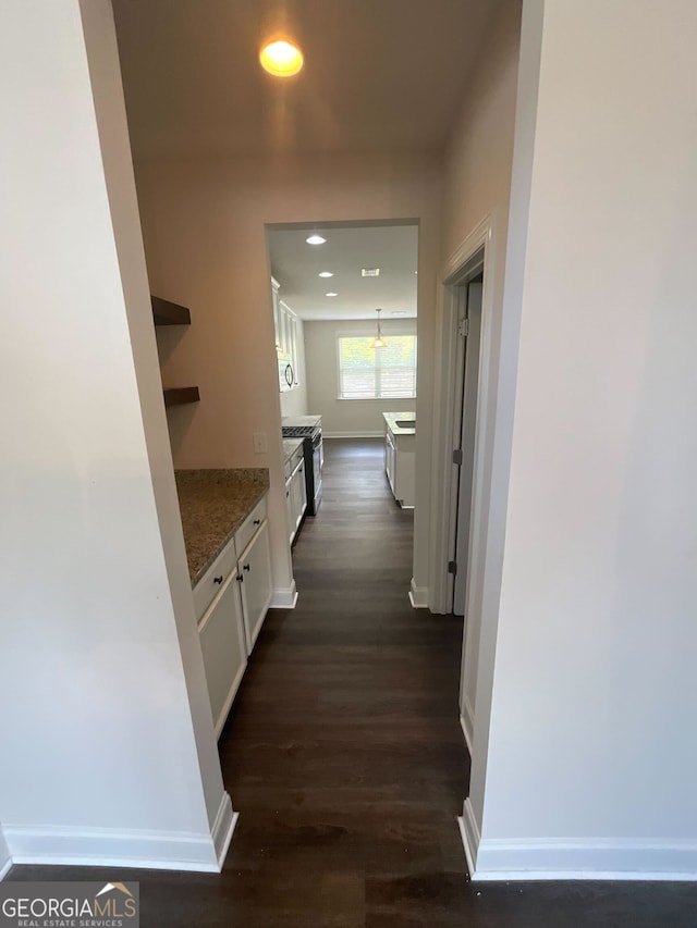 hallway featuring dark wood-type flooring