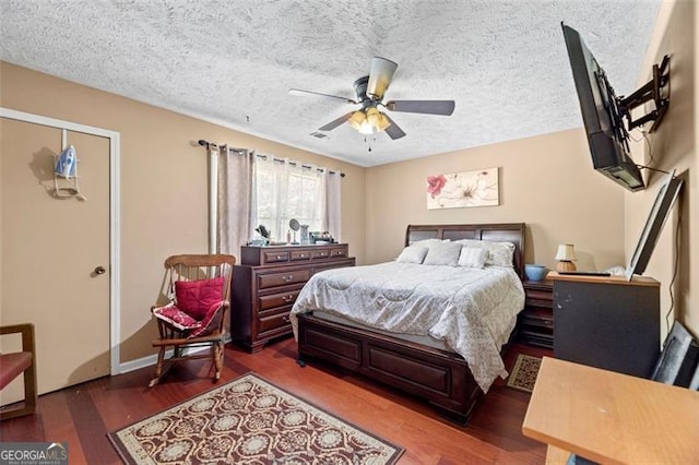 bedroom with a textured ceiling and hardwood / wood-style floors