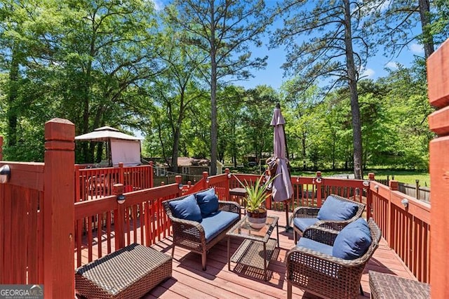 wooden deck featuring an outdoor living space