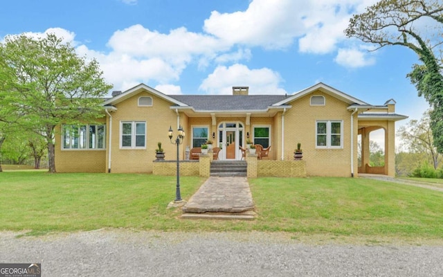 ranch-style home with a front lawn