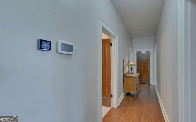 hallway featuring hardwood / wood-style flooring