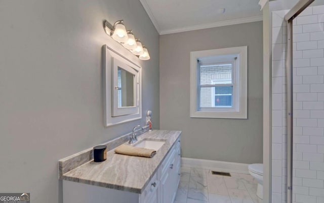 bathroom with ornamental molding, tile floors, vanity, and toilet