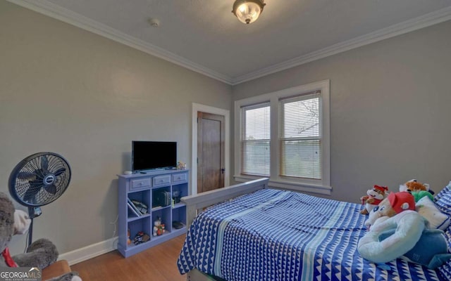 bedroom featuring ornamental molding and wood-type flooring