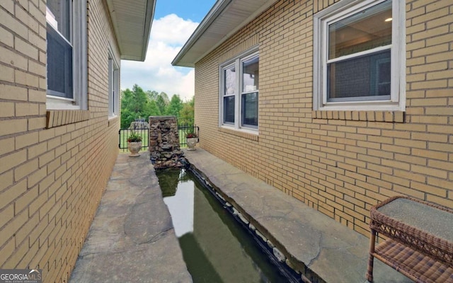 view of property exterior featuring a patio