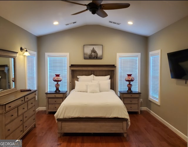 bedroom featuring ceiling fan, dark hardwood / wood-style floors, and lofted ceiling