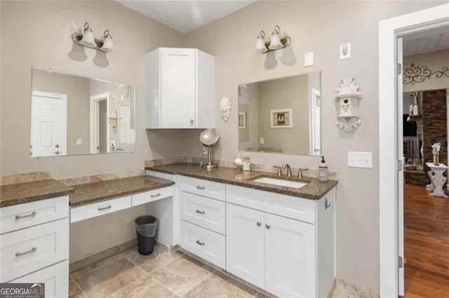 bathroom featuring wood-type flooring and vanity