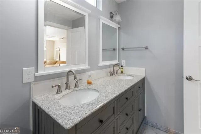 bathroom featuring dual bowl vanity