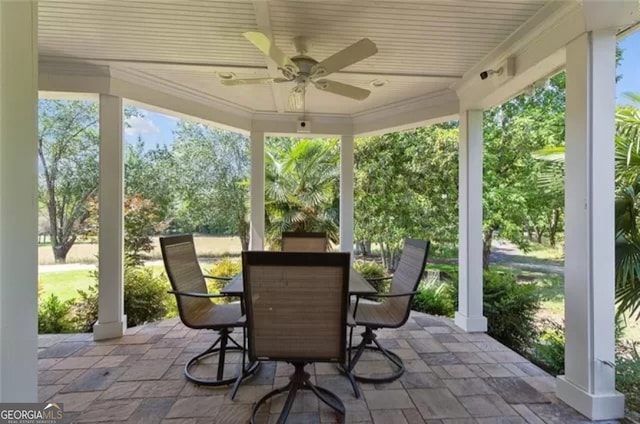 sunroom featuring ceiling fan