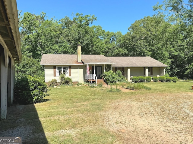 ranch-style home with a front lawn