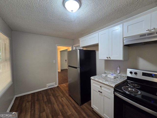 kitchen with dark hardwood / wood-style flooring, white cabinetry, stainless steel appliances, light stone counters, and a textured ceiling