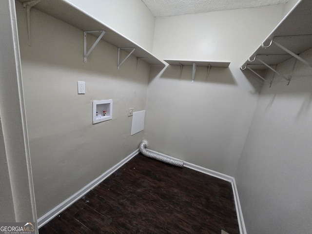 laundry area with wood-type flooring and hookup for a washing machine