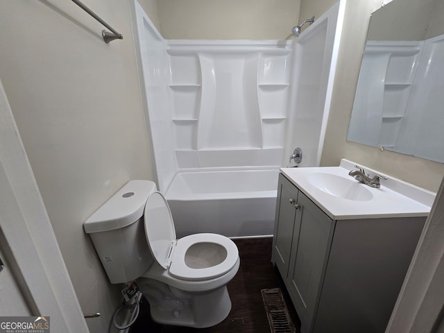 full bathroom featuring bathing tub / shower combination, wood-type flooring, vanity, and toilet