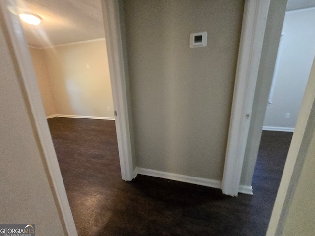 hallway with dark carpet