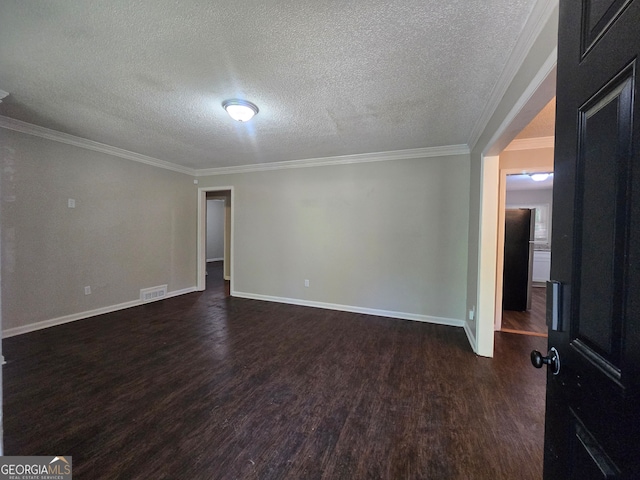 unfurnished room with a textured ceiling, crown molding, and dark wood-type flooring