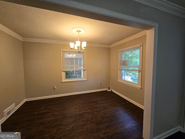 empty room with dark hardwood / wood-style flooring, a chandelier, crown molding, and a textured ceiling