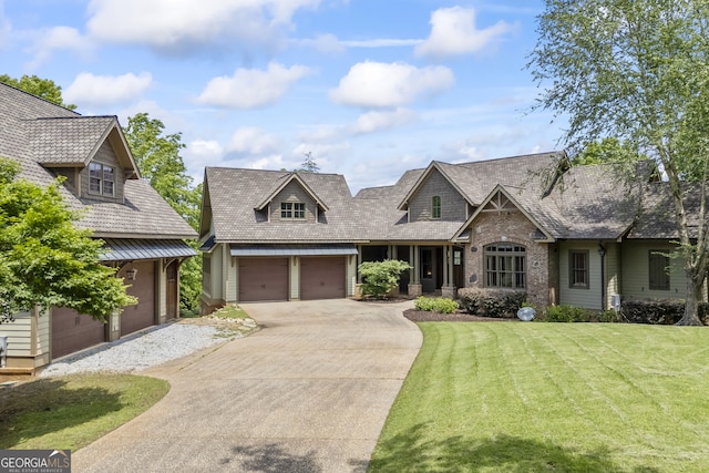 view of front of house featuring a garage and a front yard