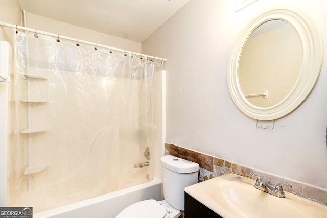 full bathroom with vanity, shower / tub combo, and toilet