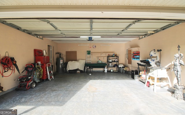 garage with electric water heater and a garage door opener