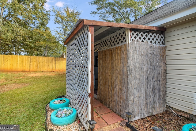 view of shed / structure with a lawn