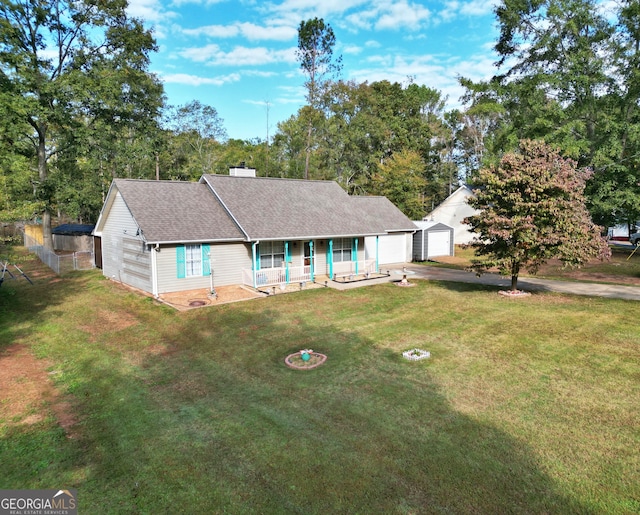 view of front of house with a garage and a front lawn